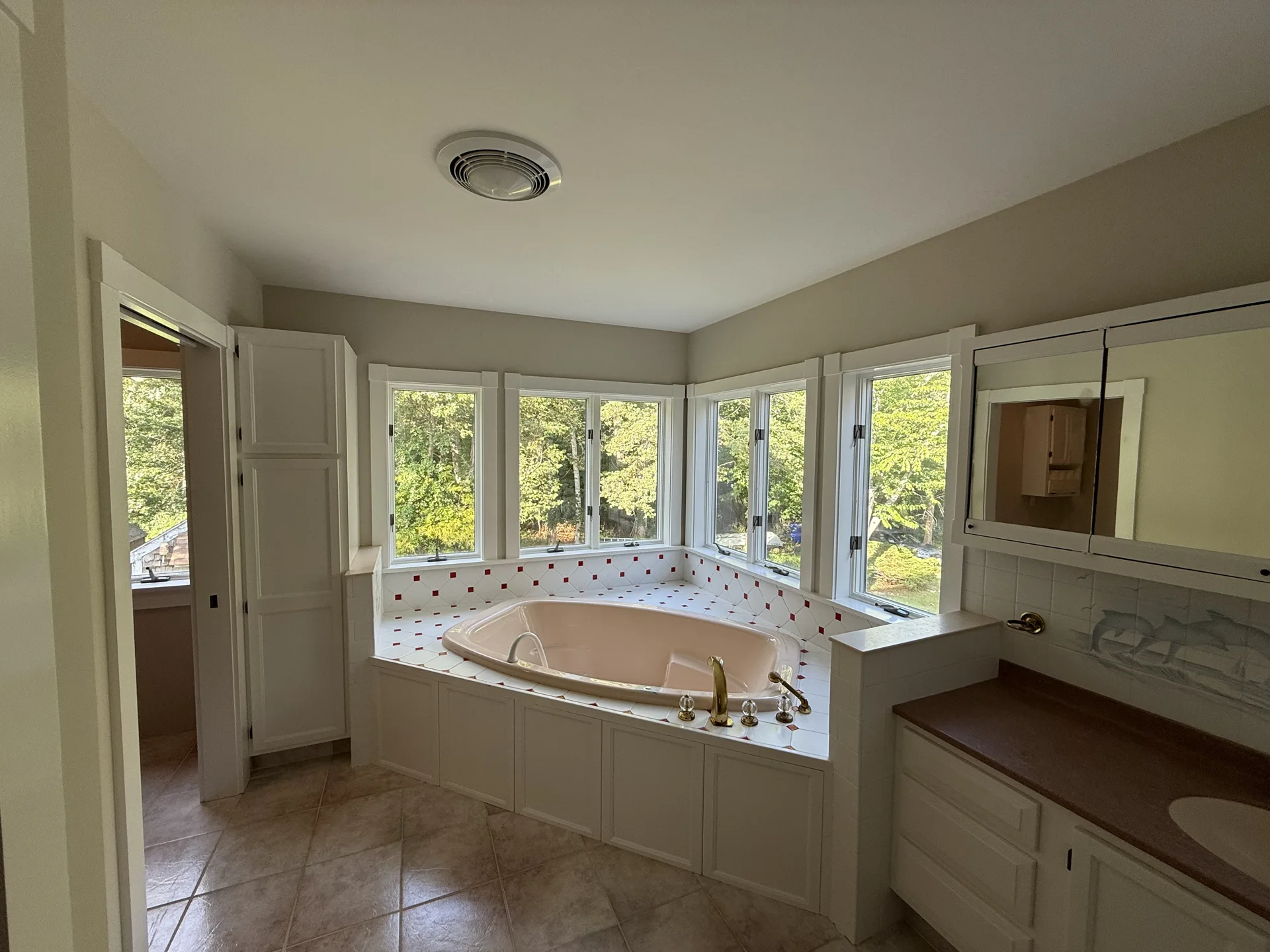 Primary bathroom with soaking tub and refreshed painted walls
